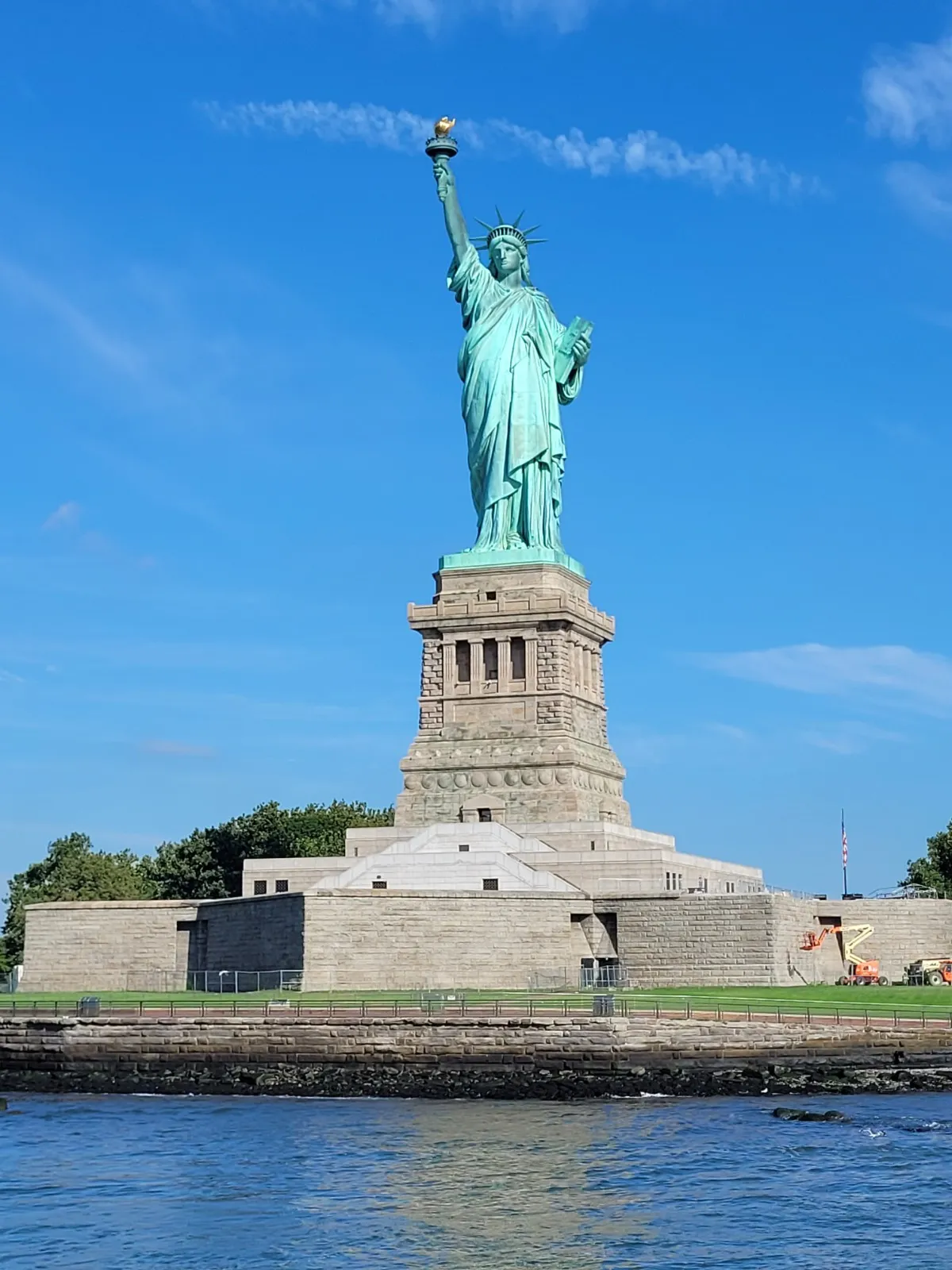 Majestic Statue of Liberty against clear blue sky