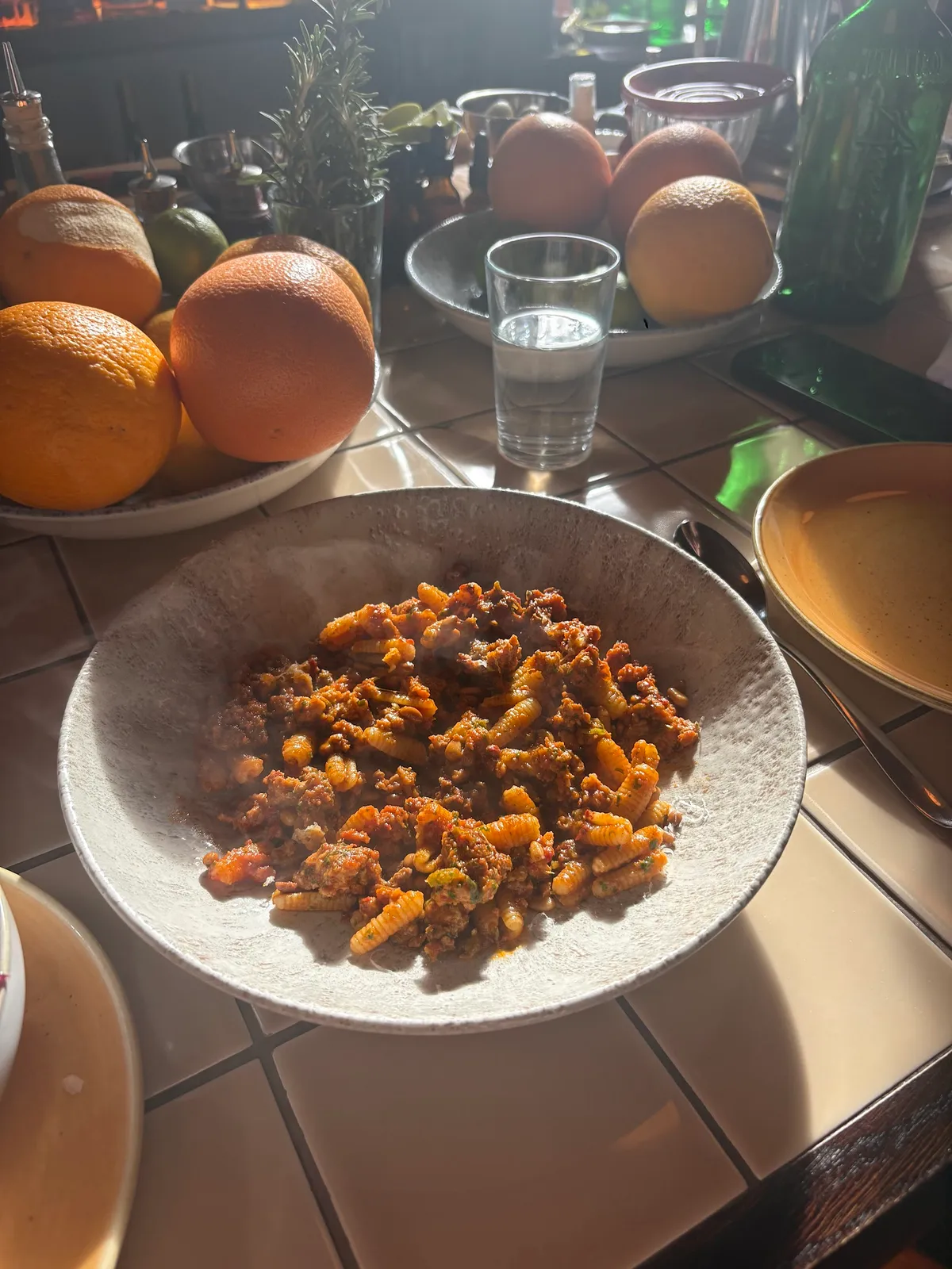 Hearty pasta dish with rich meat sauce and citrus.