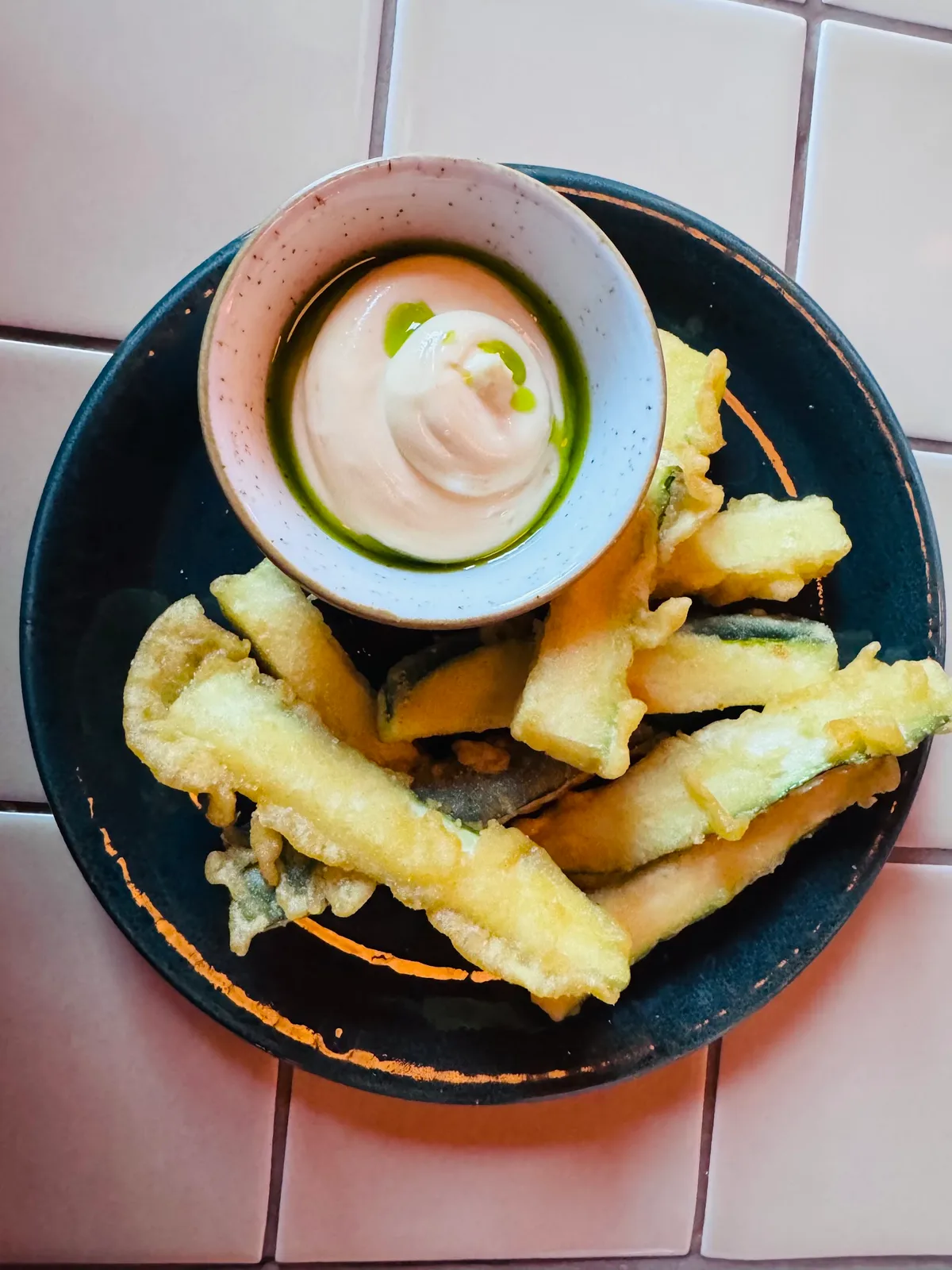 Crispy zucchini fries with creamy herb aioli