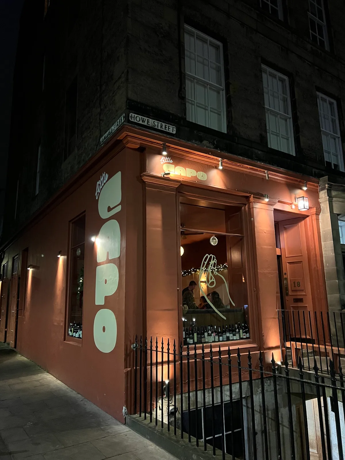 Warmly lit Little Capo exterior on Howe Street