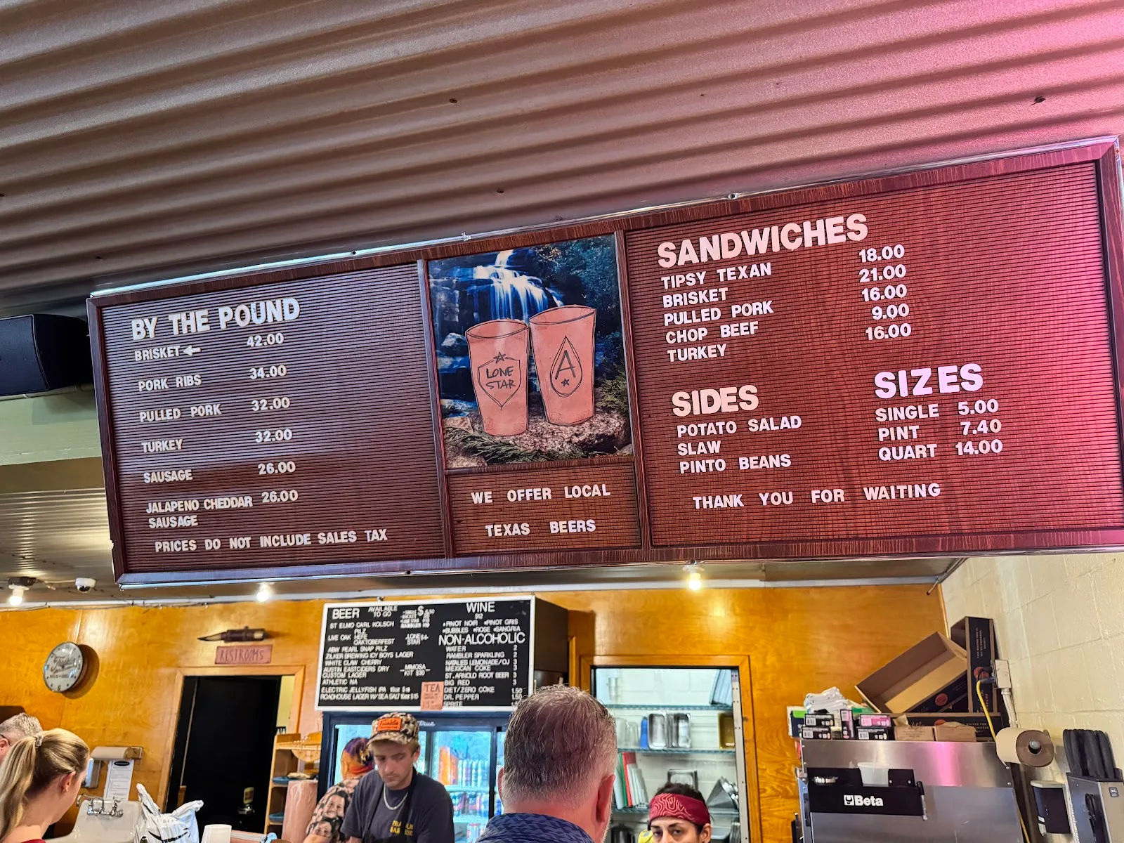Detailed menu board with barbecue offerings and prices
