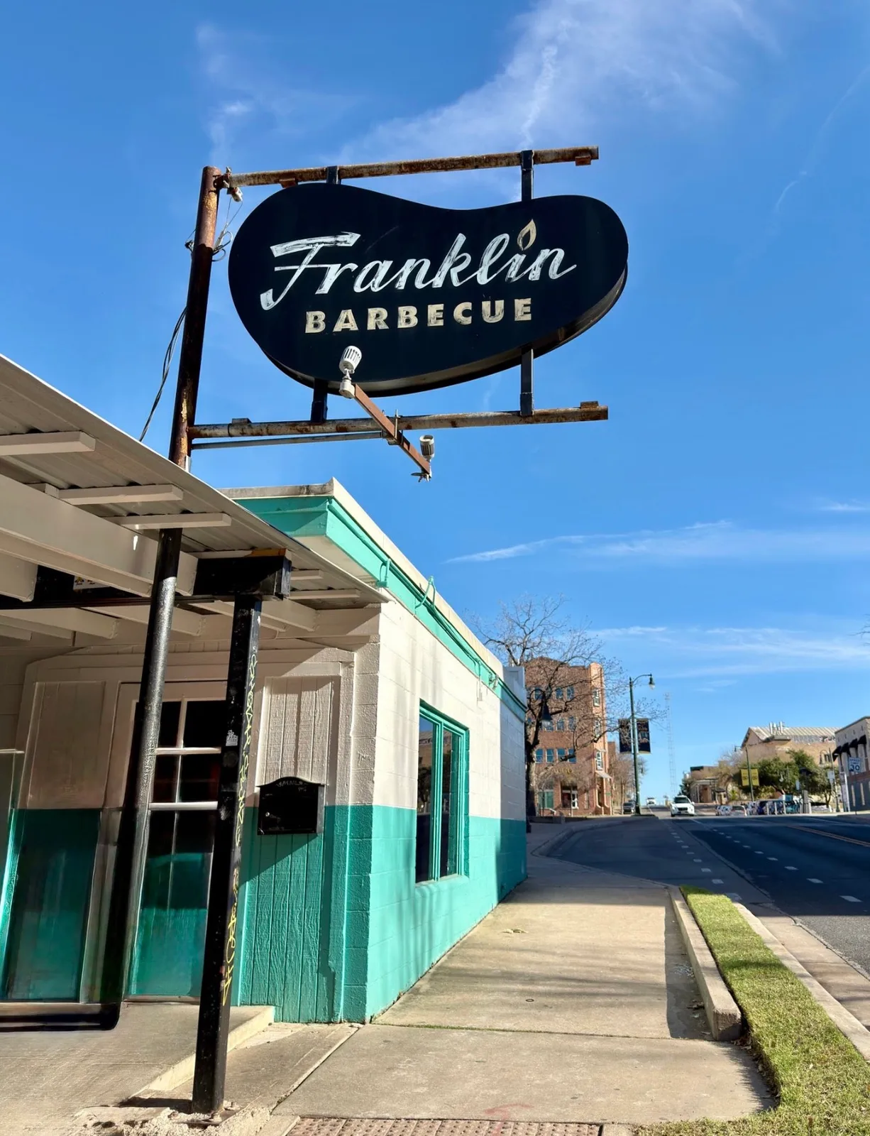 Franklin Barbecue's classic sign against a blue sky