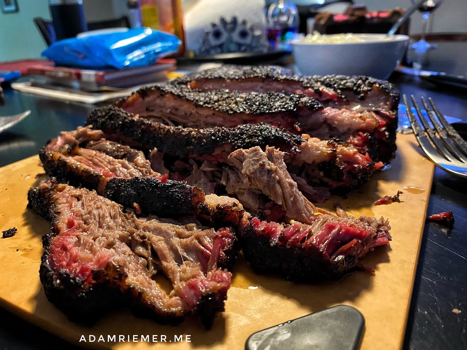 Perfectly sliced, juicy smoked brisket with beautiful bark.
