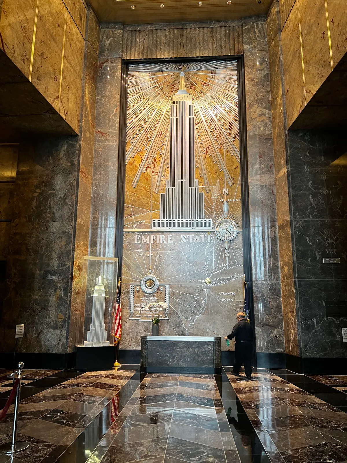 Grand Art Deco lobby with iconic Empire State mural