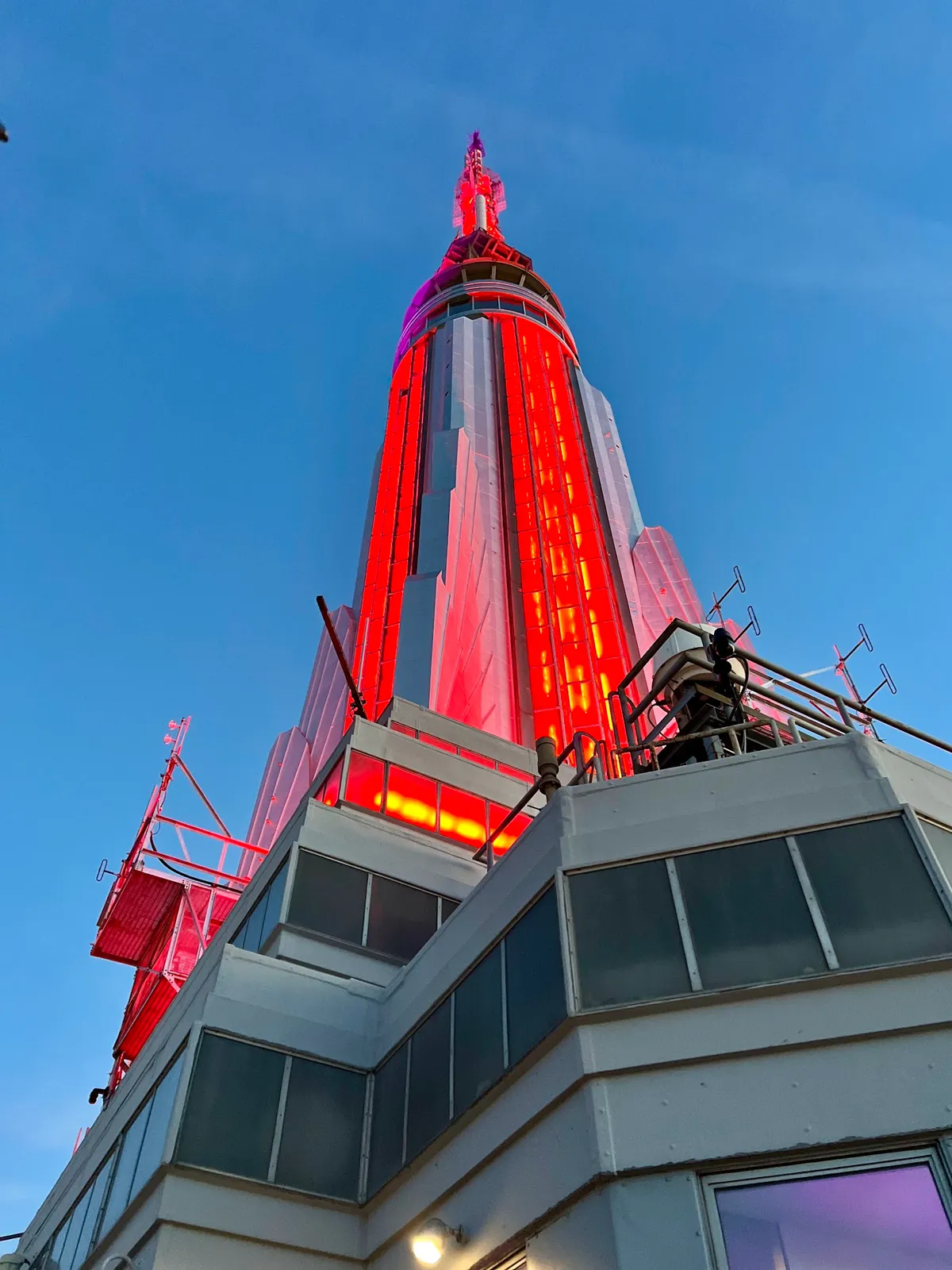 Vibrant red lights illuminate iconic skyscraper