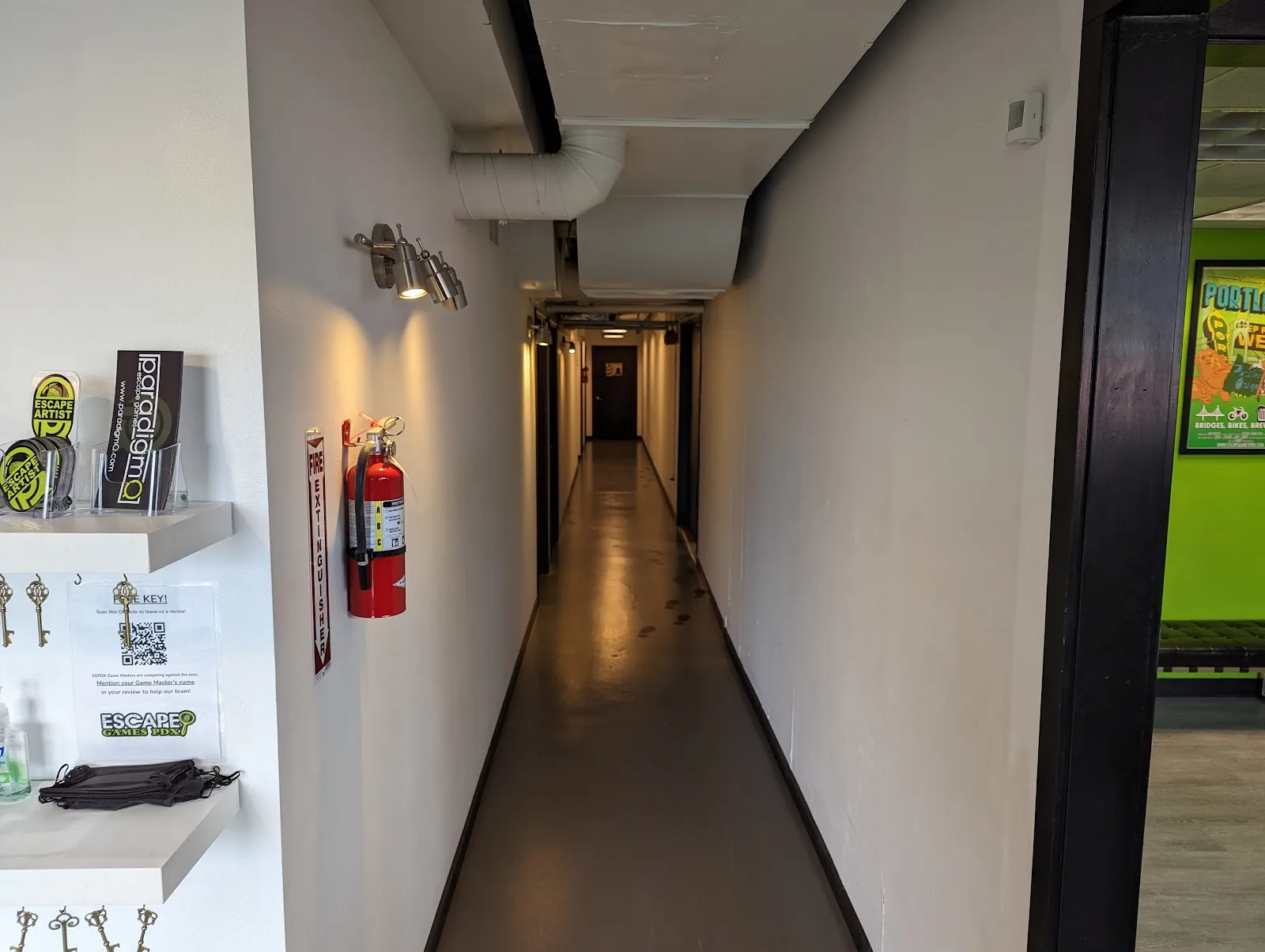 Long, narrow hallway leading to escape rooms.