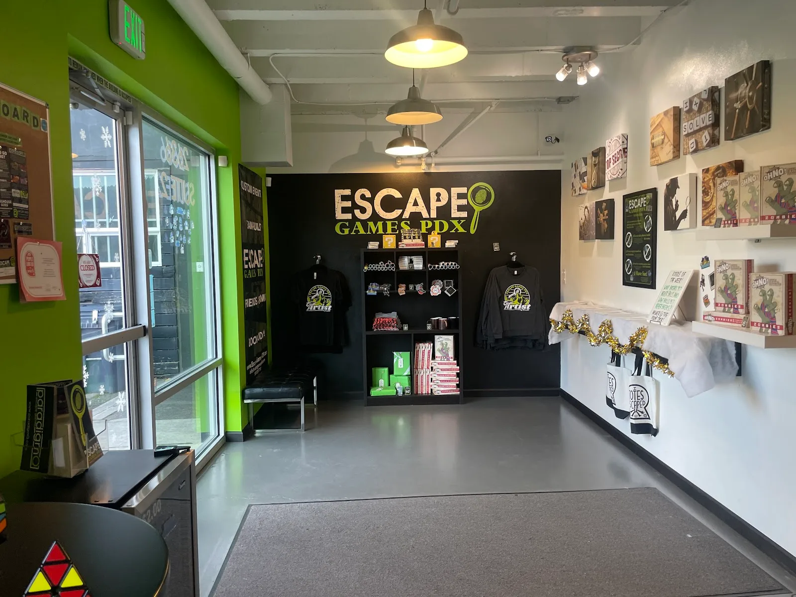 Spacious lobby, branded merchandise, puzzle games, entrance.