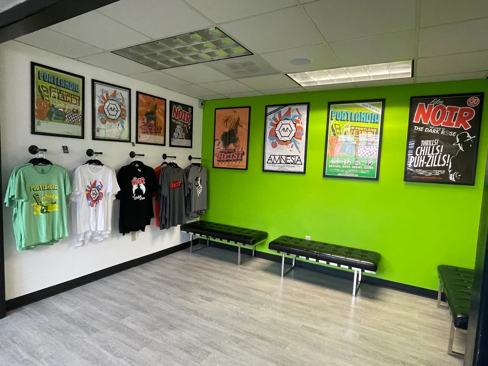 Bright green waiting area, game art, branded apparel.