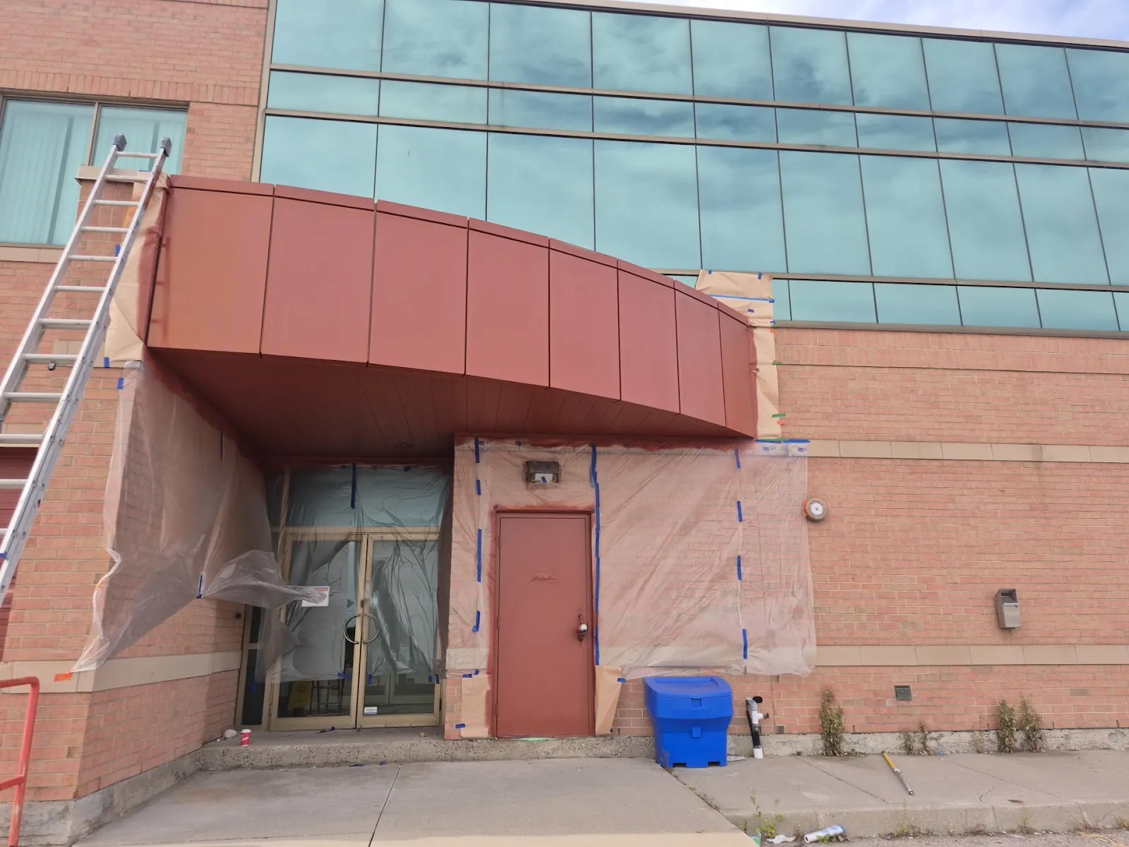 Commercial building exterior painting project in progress