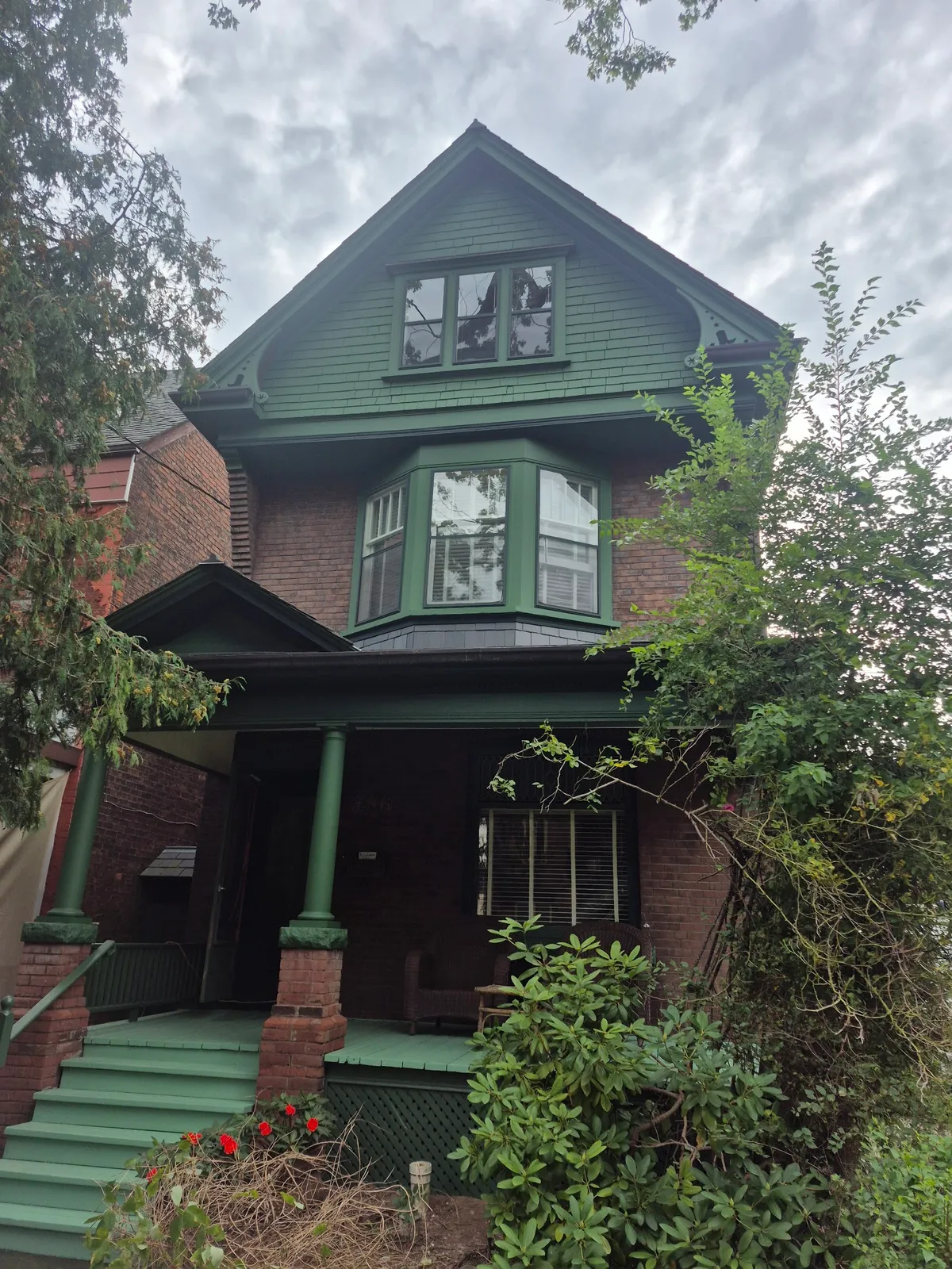 Charming historic house with fresh green exterior paint
